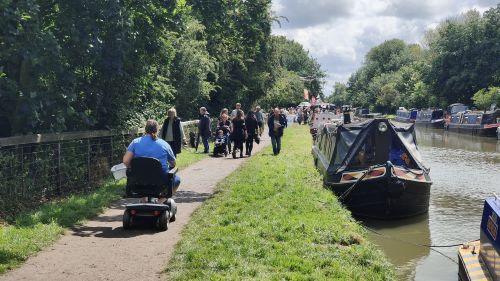 Towpath Code: Busy towpath, including a person in a wheelchair and a family with a pushchair.