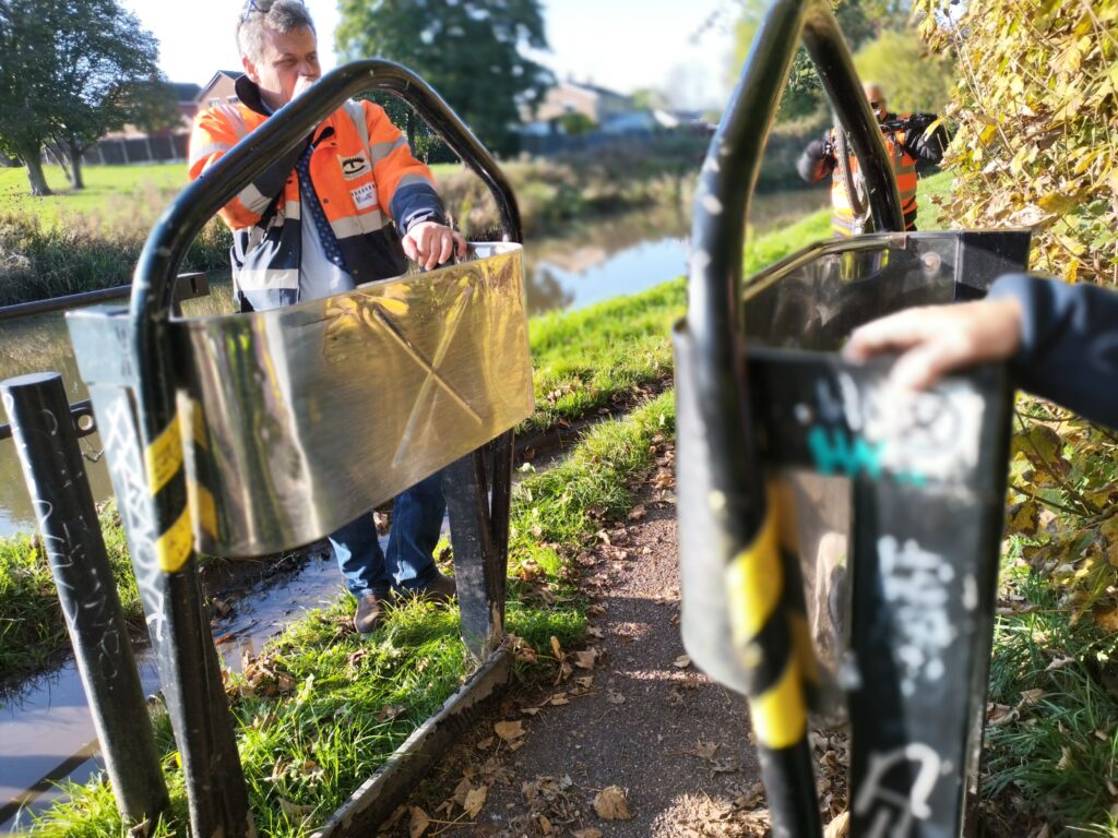 Metal Motorcycle barrier, showing the stainless steel plates that CRT are looking to remove.